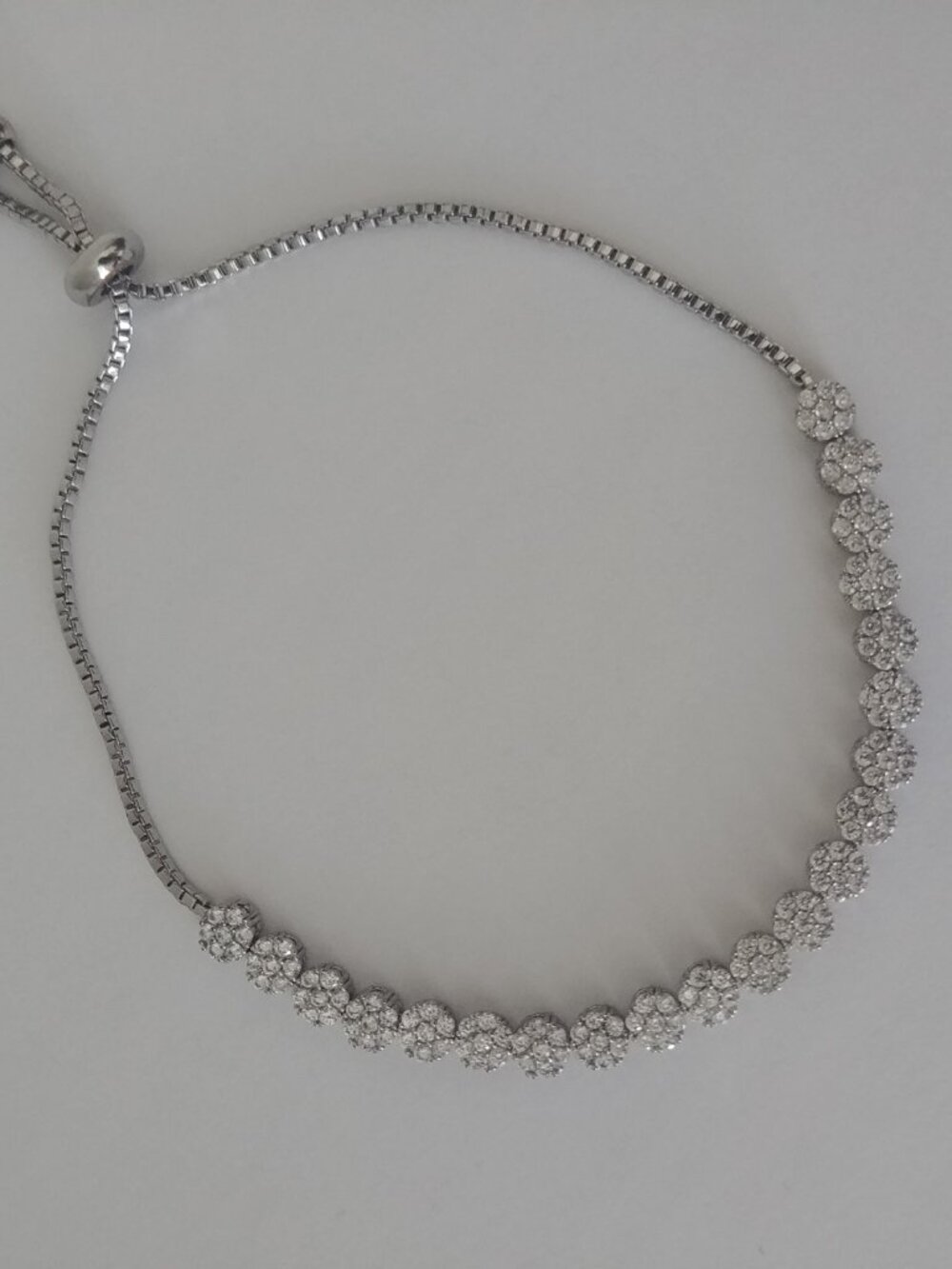 Dainty silver tone imitation diamond crystal flower chain drawstring clasp